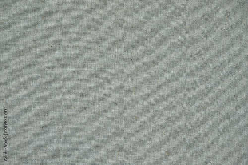 Natural linen surface. High resolution cotton canvas texture. Copy space. Top view.