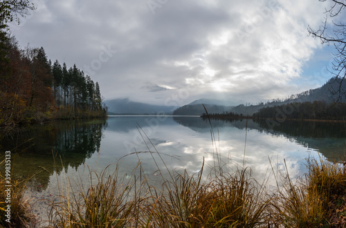 beautiful lake with colorful trees in autumn panorama