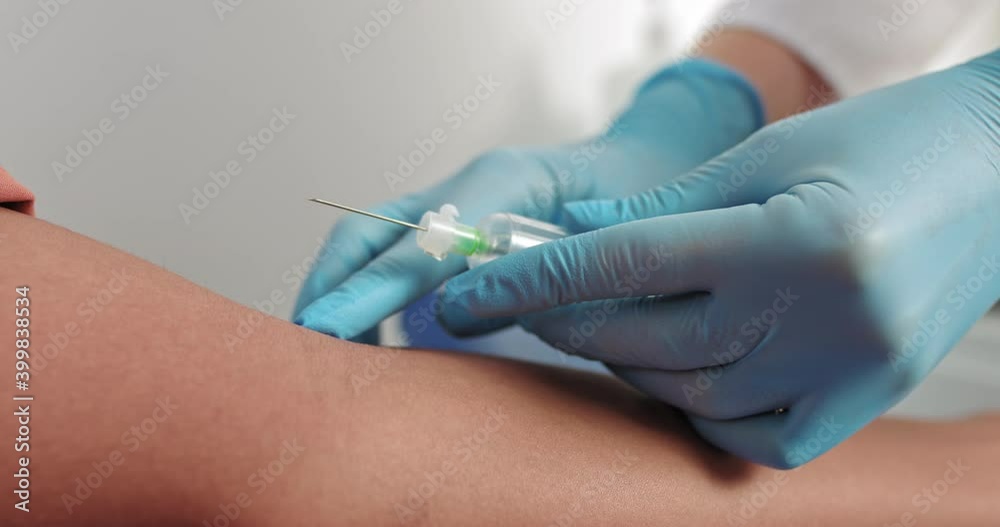 Laboratory worker doctor takes a blood sample for analysis, hand closeup. Blood sampling in the laboratory. Taking a blood in cosmetology clinic before PRP therapy procedure