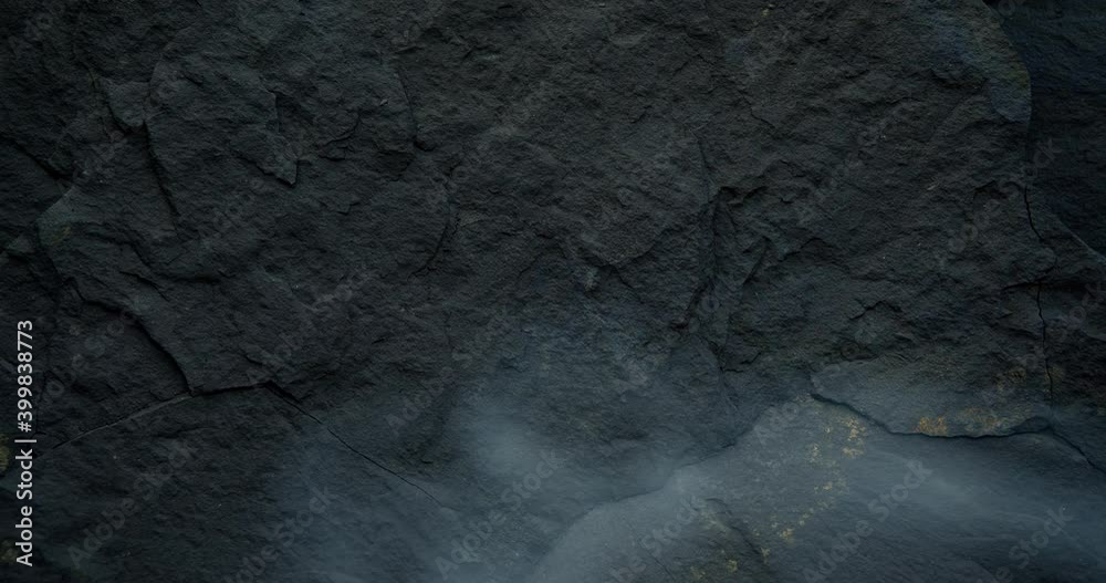 Looped black background with dark stone texture. Harsh, brutal and rough black backdrop. Looped black background with dark stone texture. Harsh, brutal and rough black backdrop.