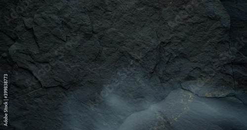 Looped black background with dark stone texture. Harsh, brutal and rough black backdrop.