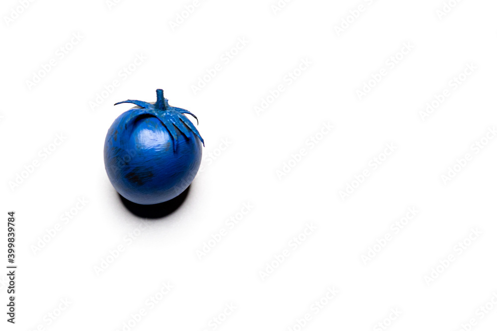Blue tomato on a white clean background. Fancy products Blue tomato on a white clean background. Fancy products