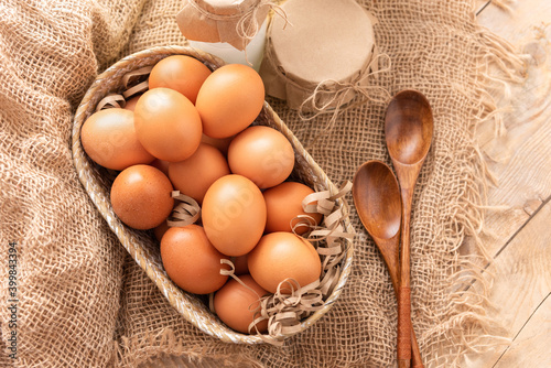 Fresh chicken eggs on a wooden table. photo