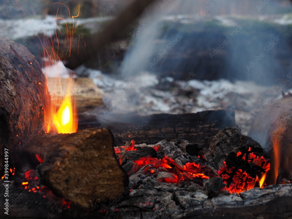 Elements of a bonfire in the night. Charcoal, firewood, sparks, flames, smoke and fire glare. Elements of a bonfire in the night. Charcoal, firewood, sparks, flames, smoke and fire glare.