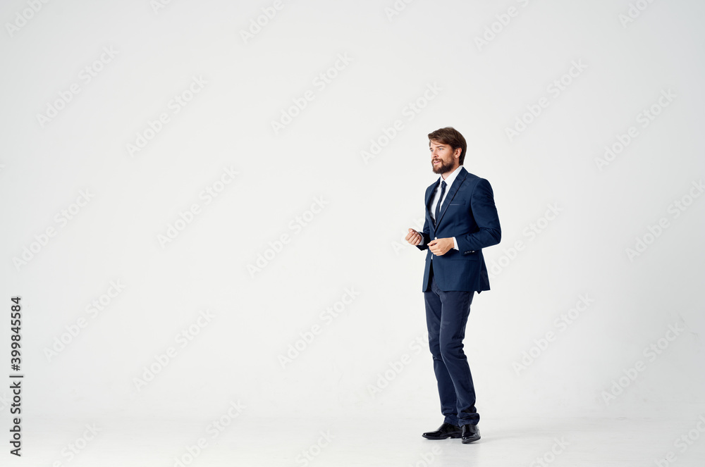 confident businessman in a classic suit on a light background Copy Space