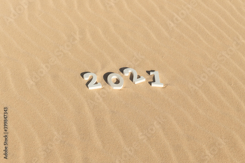 2021 on sand dunes background