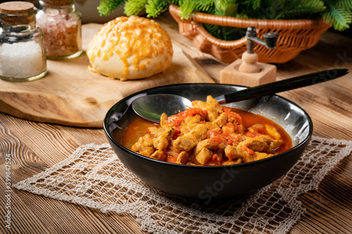 Photos Chicken fricassee with red paprika and onion.