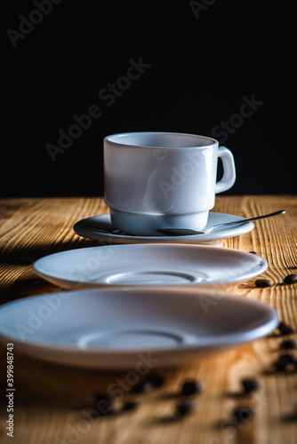 Fototapeta Naklejka Na Ścianę i Meble -  close up view, cup of white coffee with tea plates on wooden surface with space. Morning coffee concept