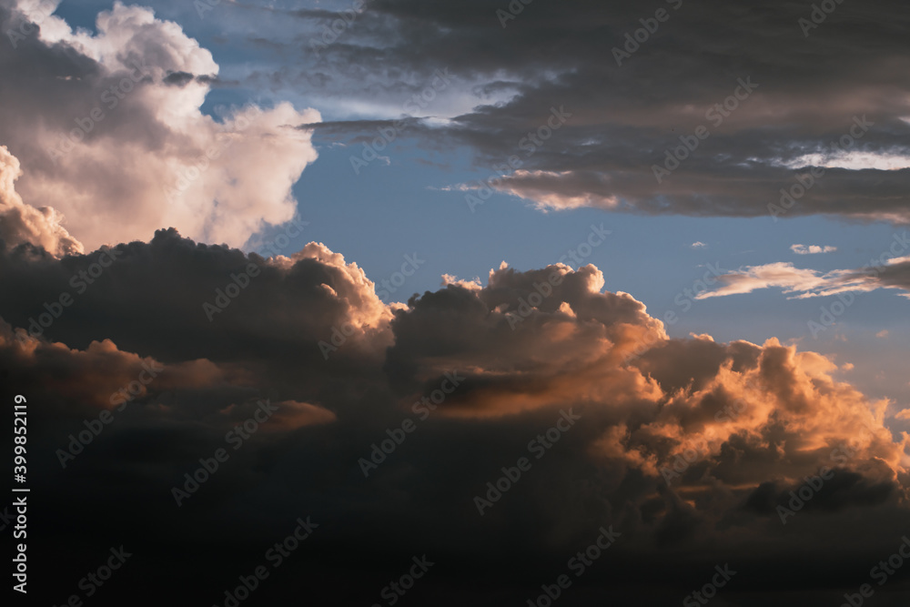 Dramatic cloudscape with intense blue sky and golden clouds.