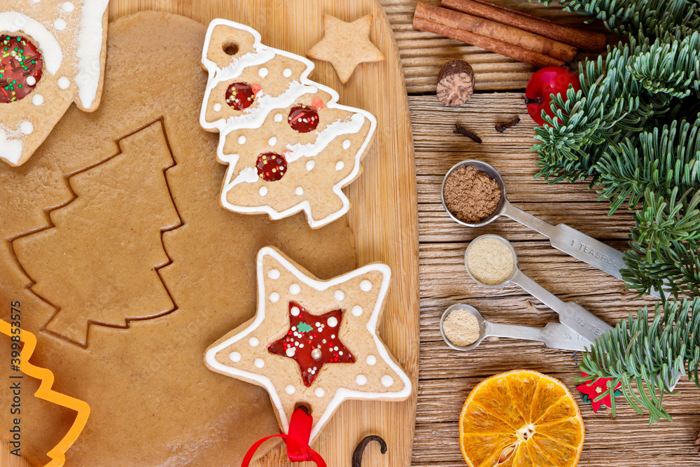 Process of cutting christmas gingerbread cookie dough on rustic wooden table with cookie cutters. Process of cutting christmas gingerbread cookie dough on rustic wooden table with cookie cutters.