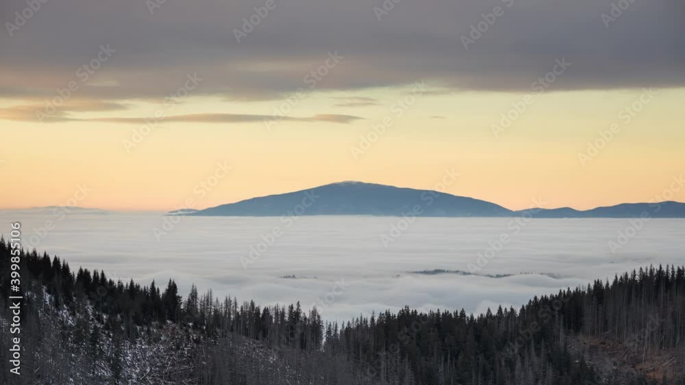 Babia Gora in the clouds. Sunset over Tatra mountains seen from Gesia Szyja on the Polish-Slovak border. Babia Gora in the clouds. Sunset over Tatra mountains seen from Gesia Szyja on the Polish-Slovak border.
