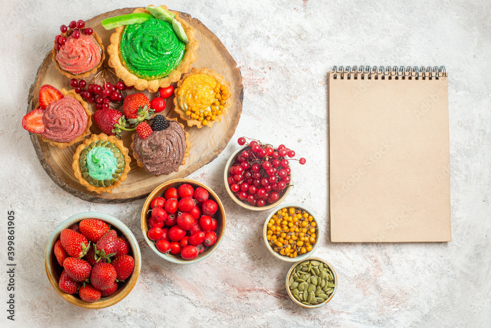 top view yummy creamy cakes with different fruits on white background biscuit dessert pie top view yummy creamy cakes with different fruits on white background biscuit dessert pie