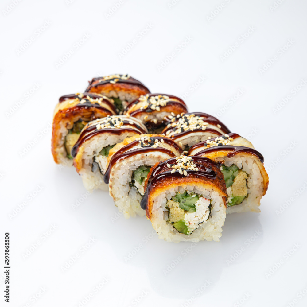 Japanese cuisine. Sushi roll with smoked eel on white background.