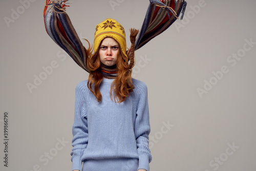 woman with a scarf around her neck headdress sweater warm clothes model