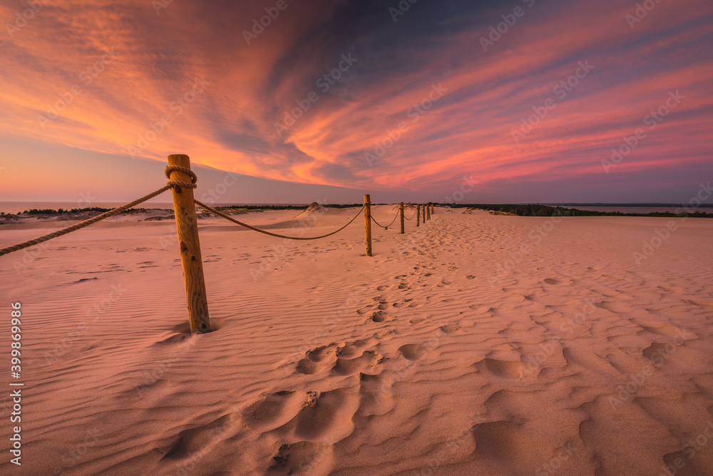 Moving dunes in the Słowiński National Park after sunset with an incredibly beautiful sky.
