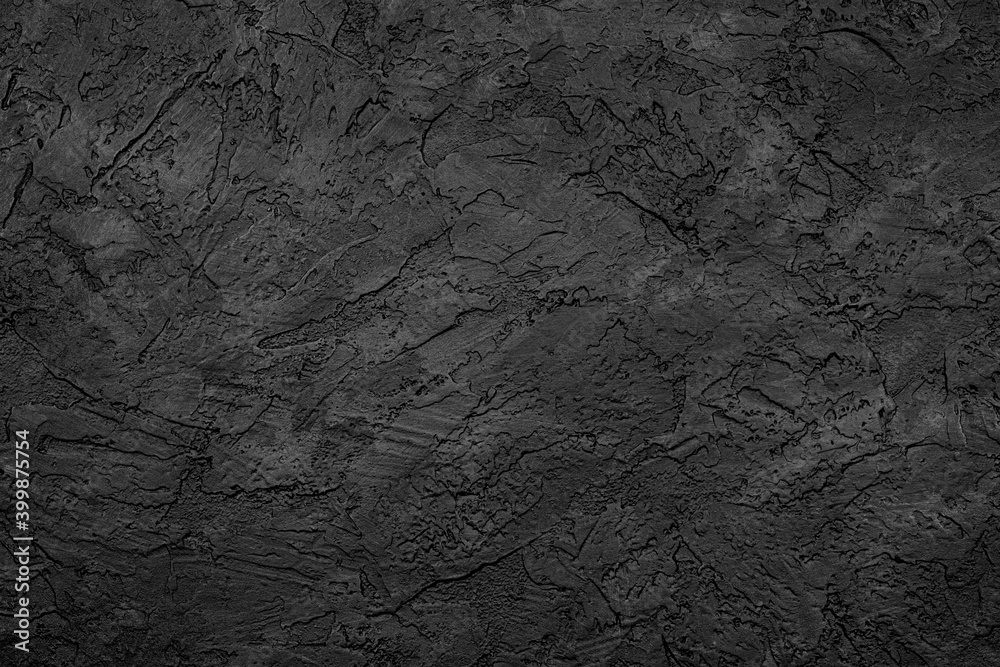 Black stone background texture. Black stone plaster cement. Grunge wall