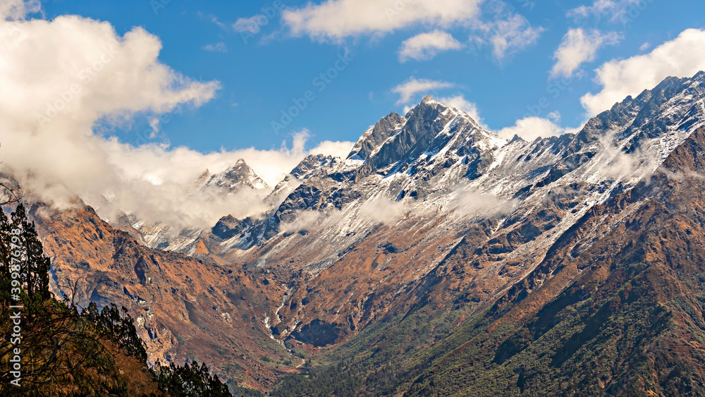 The Himalayan mountain landscape on the trekking route from Khotey to Thuli Kharka on Mera Peak trek in Nepal.
