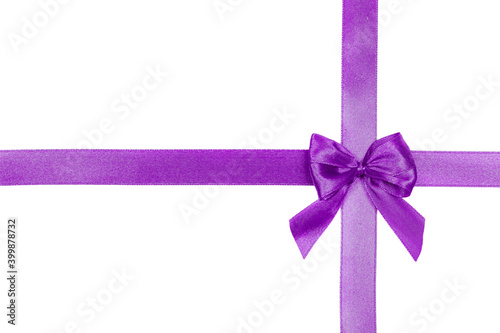 Purple satin ribbon with a bow isolated on white background. Decoration concept.