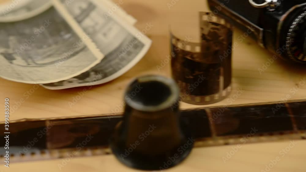 Old vintage negative strip and photo gear on a table