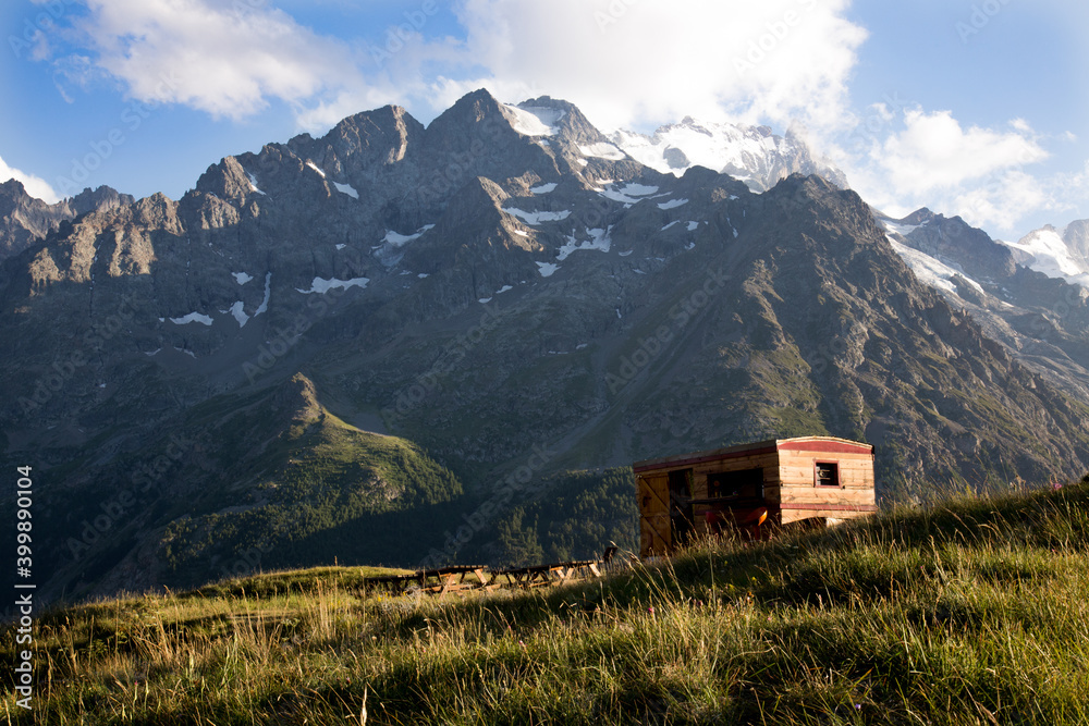 A Wooden Snack Shack with the Majestic Mountain Peak of La Meije, La Grave, Haute Alps France