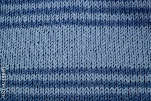 Blue knitted texture with stripes