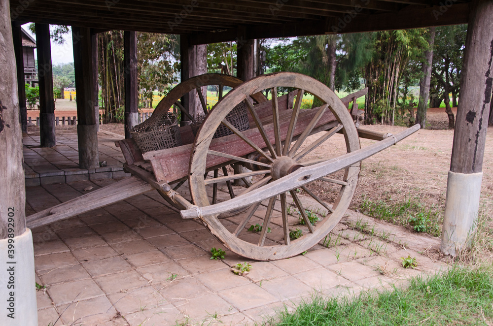 Old thai wooden wagon on the floor under house