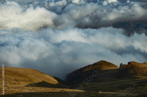 A forest of clouds at the mountain edge.