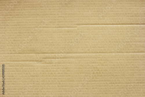 Brown corrugated paper texture background with space for design.