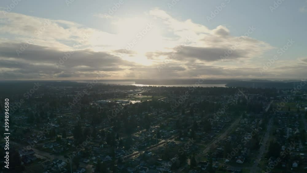 Scenic View Of Sunrise Sky Over Peaceful Neighborhood By The Puget Sound At North End Tacoma, Washington. - Aerial Shot Scenic View Of Sunrise Sky Over Peaceful Neighborhood By The Puget Sound At North End Tacoma, Washington. - Aerial Shot