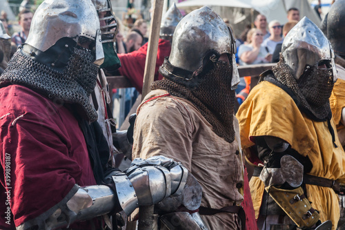 Infantry in medieval armor goes on the attack at the historical festival