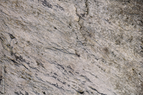 Close-up of textured rock, with small cracks, as a nature background 