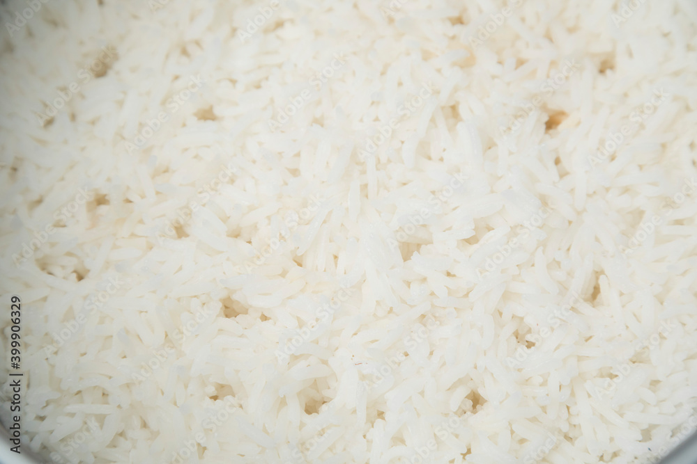 Stream rice in electric rice cooker, close up. Stream rice in electric rice cooker, close up.