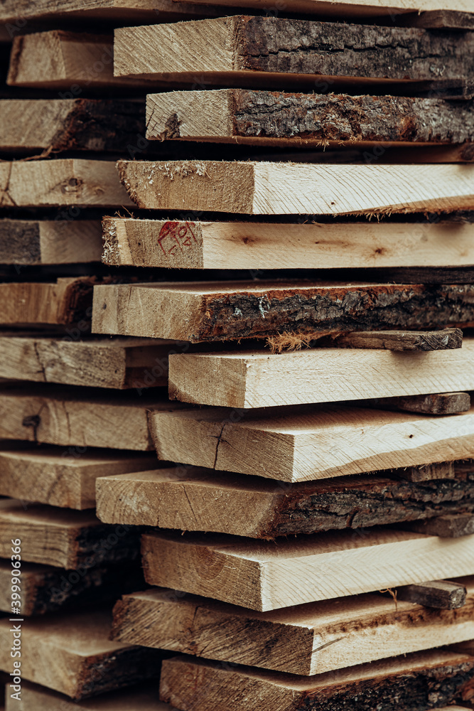 Piles of wooden boards in the sawmill, planking. 