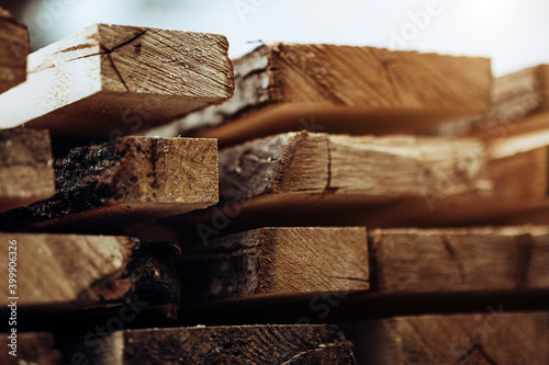 Stack Of New Wooden Studs At The Lumber Yard. Wood Timber Construction Material.