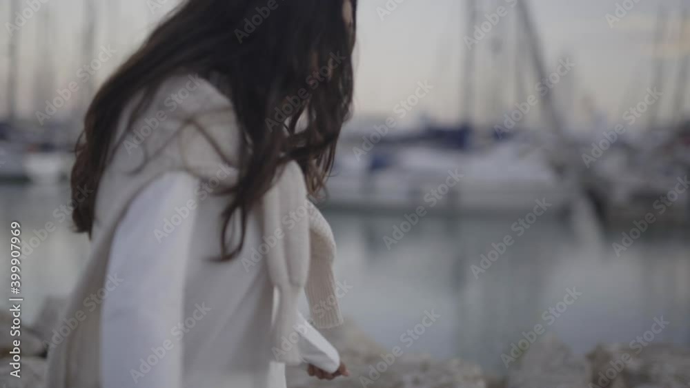 Latino wearing winter fashion clothing at a harbour dock Spain Latino wearing winter fashion clothing at a harbour dock Spain