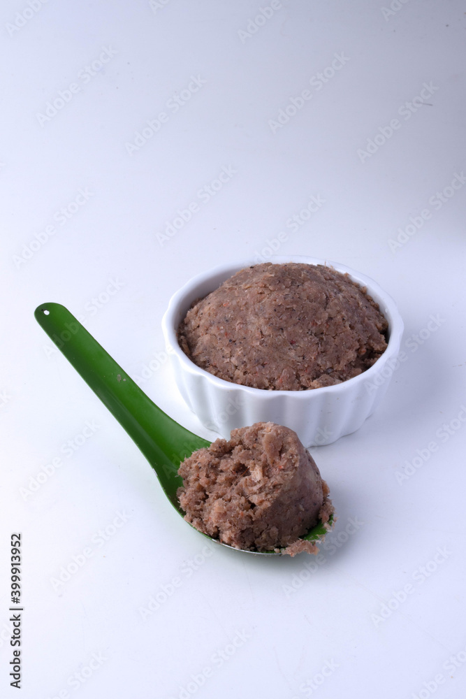 Green spoon shrimp paste on white background Green spoon shrimp paste on white background