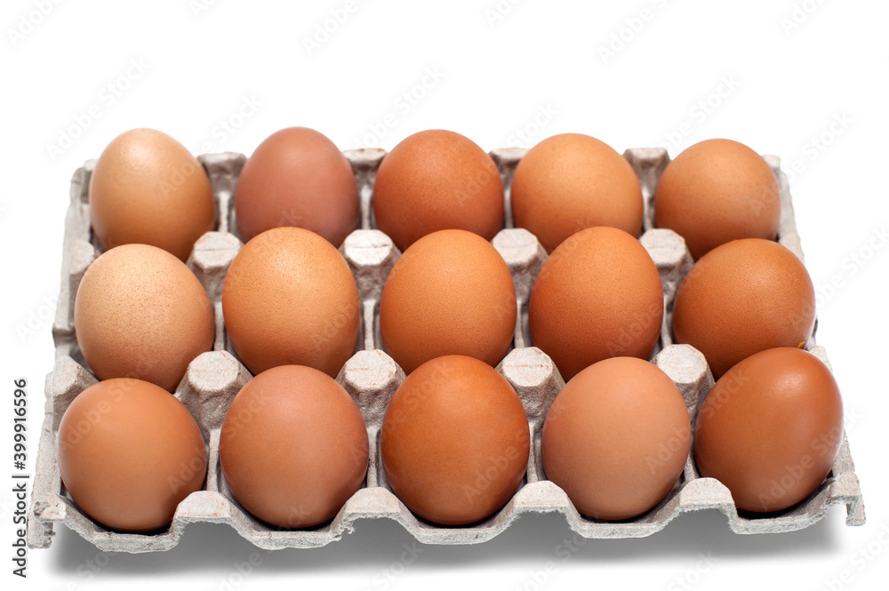 Brown raw chicken eggs in a cardboard box for eggs.Food background.