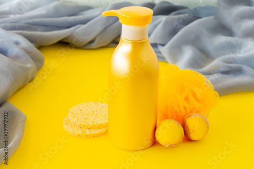 Spa treatment and body care concept in colors of the year 2021 - Illuminating yellow and ultimate grey.