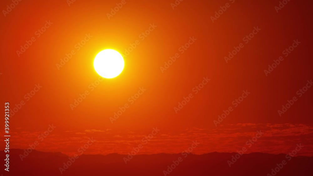 Beautiful time lapse of the sun setting behind the clouds. Beautiful time lapse of the sun setting behind the clouds.