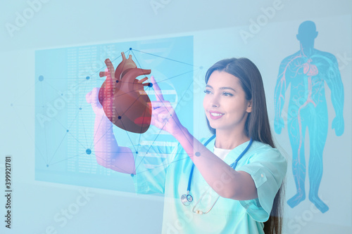 Female cardiologist using v...