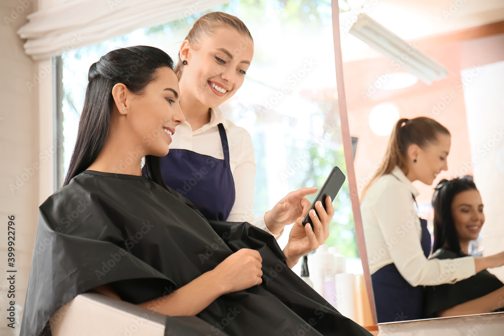 Female hairdresser working with client in salon Female hairdresser working with client in salon