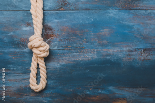 Rope with knot on color background