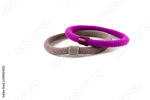 Two elastic bands for hair of pink and brown color