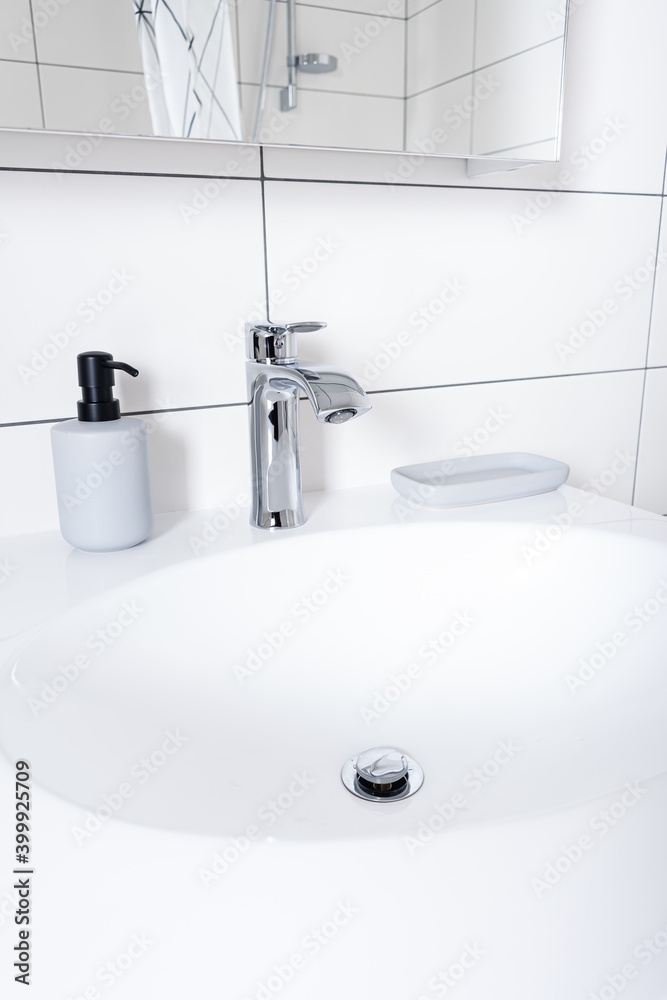 Fototapeta premium White Stone basin and steel mixer in bathroom
