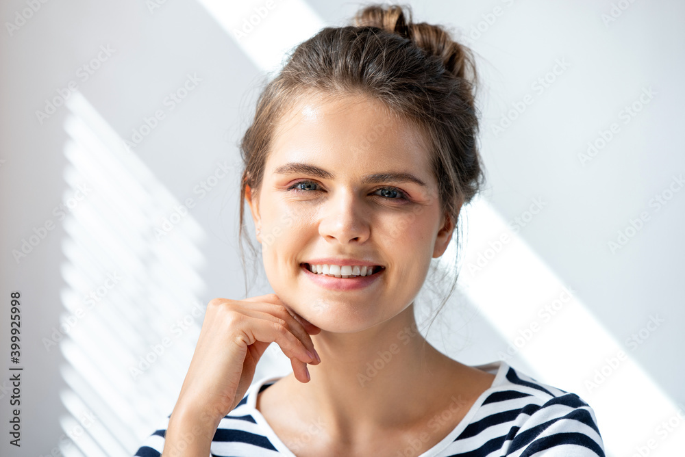Close up portrait of attractive smiling young Caucasian woman on video call in home Close up portrait of attractive smiling young Caucasian woman on video call in home