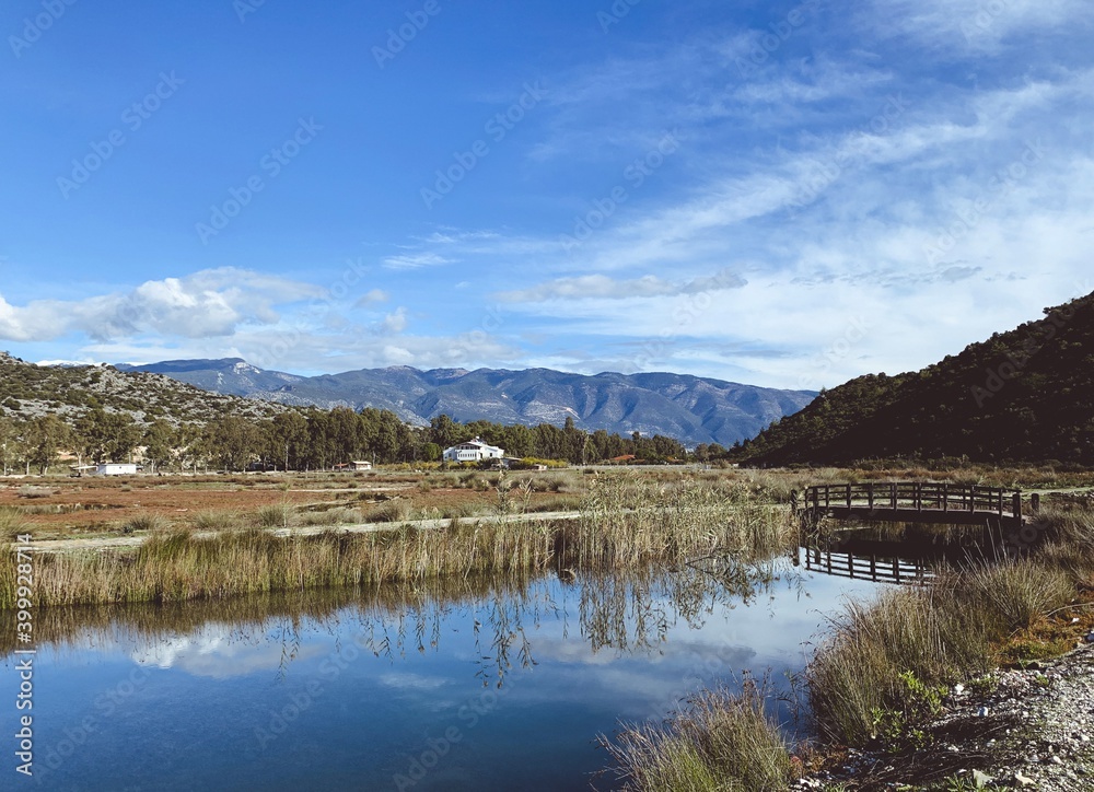 Beautiful peaceful valley with the river, reflection of the mountains on the surface of the water