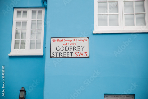 Address sign for Godfrey street on a blue wall