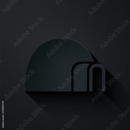Paper cut Igloo ice house icon isolated on black background. Snow home, Eskimo dome-shaped hut winter shelter, made of blocks. Paper art style. Vector.