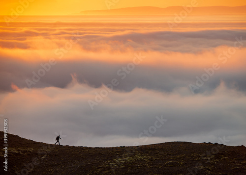  Dreamy misty landscape above the sea of clouds  mountains at sunset in Iceland