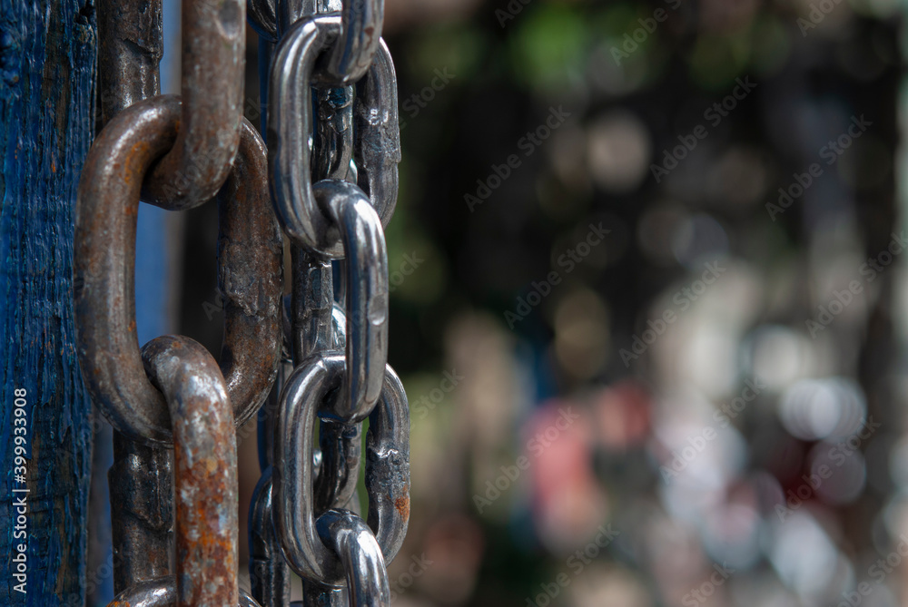 white metal chain on wooden background white metal chain on wooden background